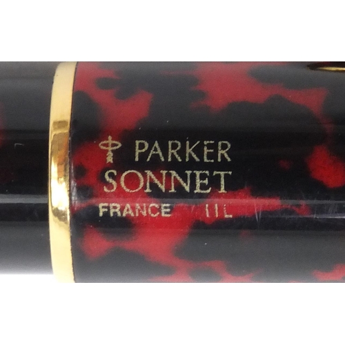 2354 - Group of objects comprising a Parker Sonnet fountain pen with 18k gold nib, silver compass pedant an... 