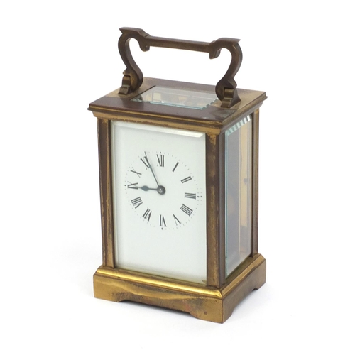 2337 - Brass cased carriage clock with enamelled dial and Roman Numerals, 12cm high excluding the handle