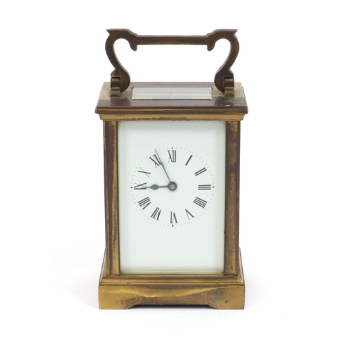 2337 - Brass cased carriage clock with enamelled dial and Roman Numerals, 12cm high excluding the handle