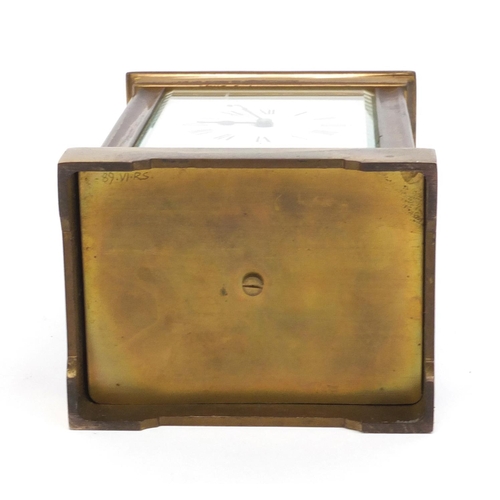 2337 - Brass cased carriage clock with enamelled dial and Roman Numerals, 12cm high excluding the handle