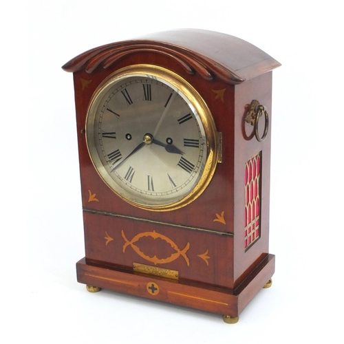 2327 - Inlaid mahogany mantle clock striking on a gong, with roman numerals and pendulum, 34cm high