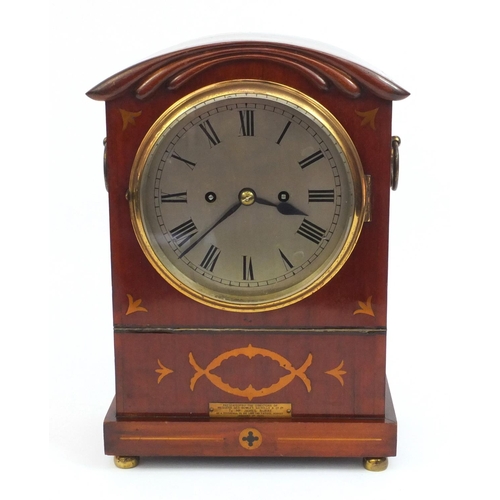 2327 - Inlaid mahogany mantle clock striking on a gong, with roman numerals and pendulum, 34cm high