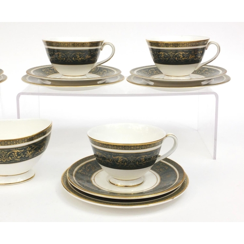 2257 - Six Royal Doulton Vanborough pattern trios, together with a matching sugar bowl, each with factory m... 