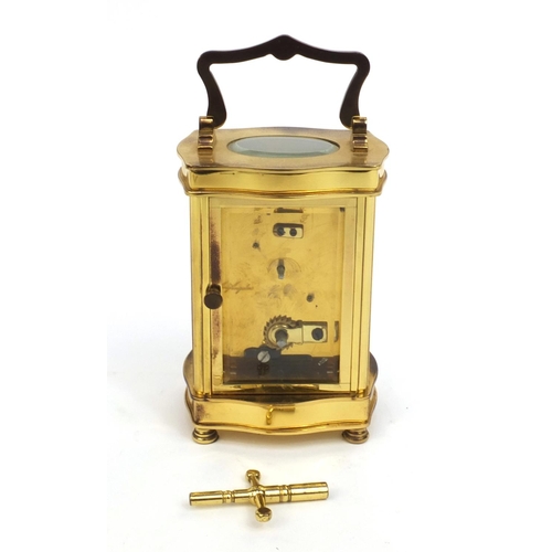 2336 - Angelus brass cased carriage clock, with roman numerals and key, 12cm high excluding the handle