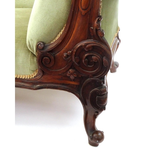 2014 - Victorian carved walnut chaise lounge with green upholstery, 94cm high x 200cm wide x 75cm deep