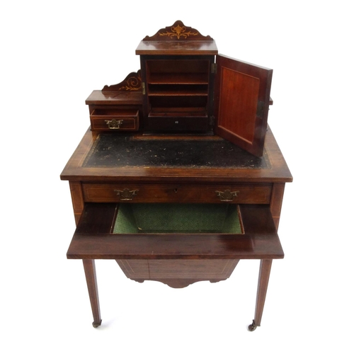 2008 - Edwardian inlaid rosewood ladies sewing desk, with tooled leather top and raised on tapering legs, 1... 