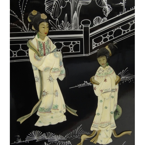 2025 - Oriental black lacquer four fold screen, decorated in relief with geisha girls and hand painted with... 