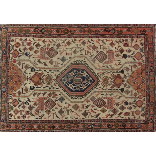 2029 - Rectangular Middle Eastern carpet with geometric border, the central field decorated with mythical c... 