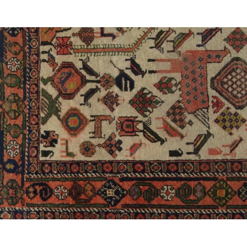 2029 - Rectangular Middle Eastern carpet with geometric border, the central field decorated with mythical c... 
