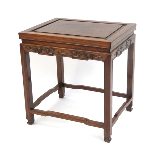 2046 - Chinese hardwood stool carved with stylised motifs, 49cm high x 46cm wide x 36cm deep