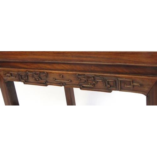 2046 - Chinese hardwood stool carved with stylised motifs, 49cm high x 46cm wide x 36cm deep