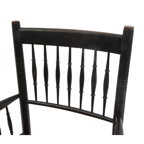 2047 - Morris style ebonised elbow chair with cane seat, 90cm high