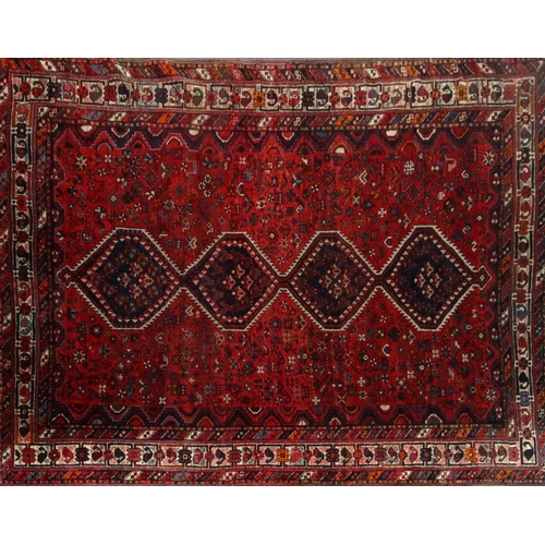 2006 - Large rectangular Middle Eastern rug with geometric border, the central filled decorated with mythic... 