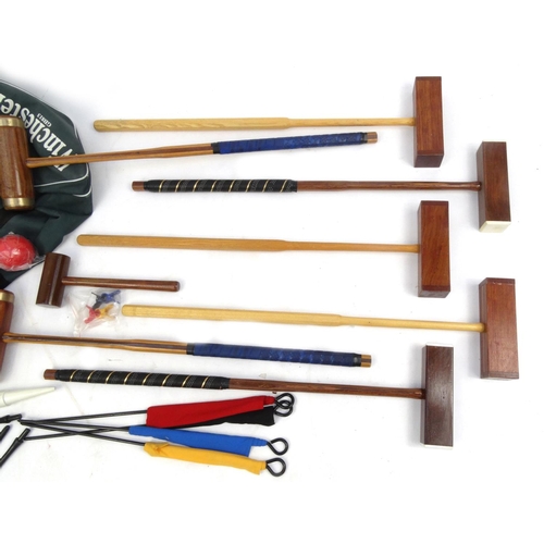 2295 - Winchester croquet set with four extra mallets, each mallet 95cm long