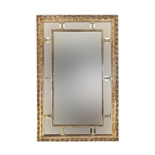 2045 - Rectangular ornate gilt framed sectional mirror, 84cm x 54cm