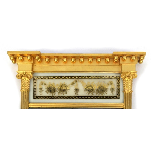 2275 - Gilt pier mirror with white glass panel decorated with gilt flowers, 83cm x 54cm