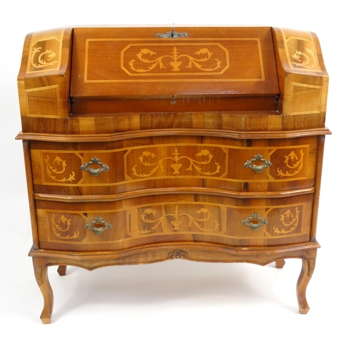 7 - Sorrento style serpentine fronted bureau fitted with a fall above two drawers, 86cm high x 83cm wide... 