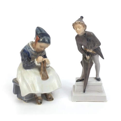 2105 - Two Royal Copenhagen figures, one of a boy holding an umbrella and one of a girl seated knitting, fa... 