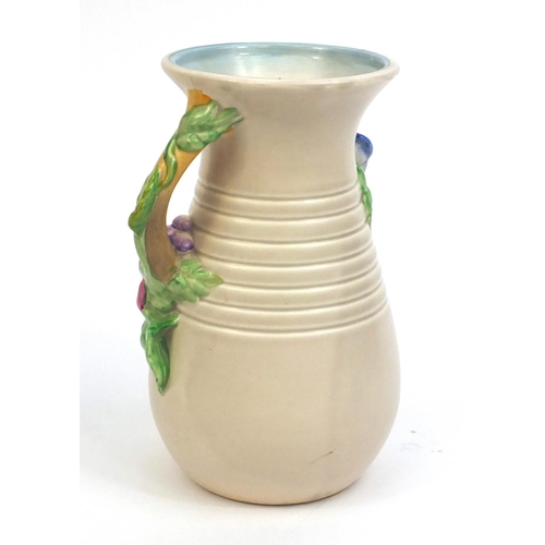 2129 - Clarice Cliff Newport pottery vase with naturalistic floral handles, factory marks to the base, 22cm... 