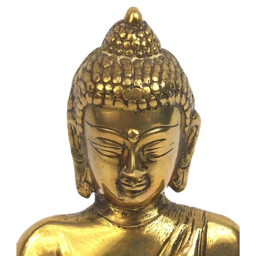 2173 - Chinese Tibetan brass Buddha seated in the lotus position, 20cm high