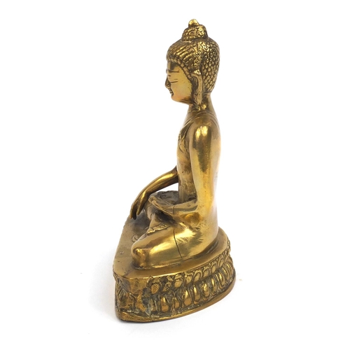 2173 - Chinese Tibetan brass Buddha seated in the lotus position, 20cm high