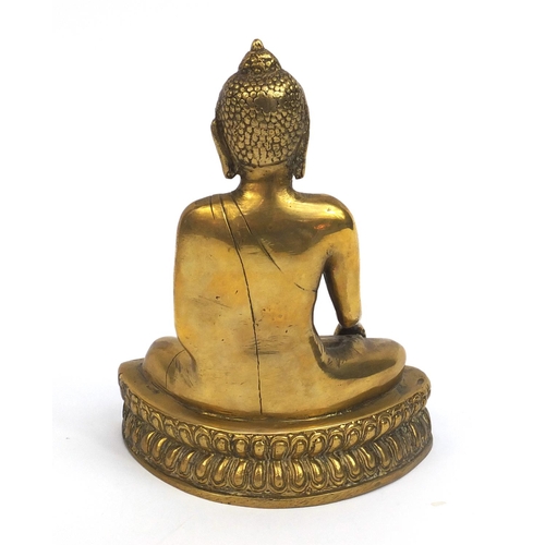 2173 - Chinese Tibetan brass Buddha seated in the lotus position, 20cm high