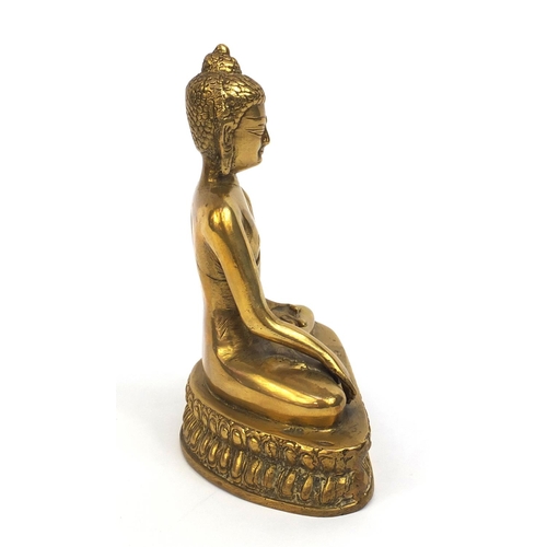 2173 - Chinese Tibetan brass Buddha seated in the lotus position, 20cm high