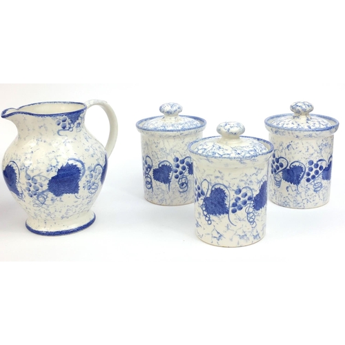 2236 - Group of hand painted Poole pottery blue leaf patterned items, comprising jug and bowl, three storag... 