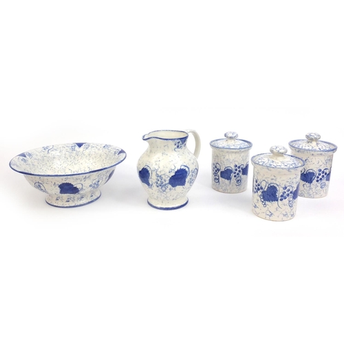 2236 - Group of hand painted Poole pottery blue leaf patterned items, comprising jug and bowl, three storag... 