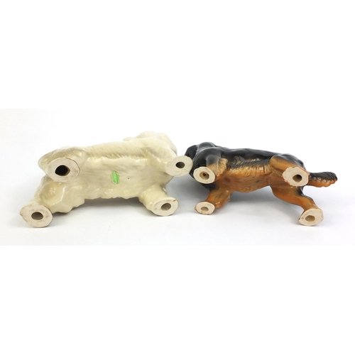 2114 - Two Beswick dogs one with original paper label, the other with factory marks to the base, the talles... 