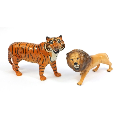 2111 - Two Beswick animals comprising a tiger and a lion, both with factory marks to the base, the tallest ... 