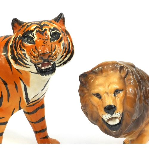 2111 - Two Beswick animals comprising a tiger and a lion, both with factory marks to the base, the tallest ... 