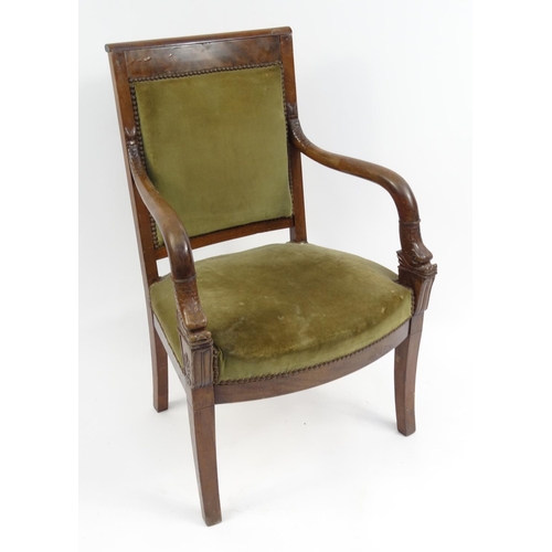 8 - French empire style mahogany armchair with carved dolphin arms