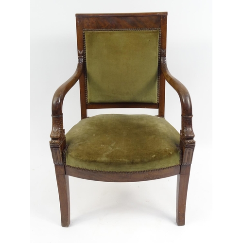 8 - French empire style mahogany armchair with carved dolphin arms