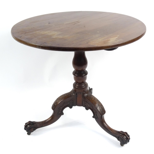 4 - Georgian mahogany tilt top table, with carved ball and claw feet, 73cm high x 80cm in diameter