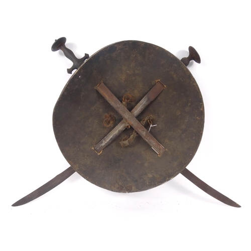 496 - Antique leather shield with cross swords