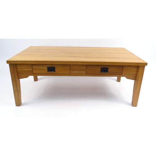 10 - Light oak coffee table fitted with two frieze drawers, 46.5cm high x 120cm long, 61cm deep