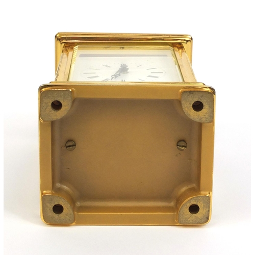 2334 - St James of London brass cased carriage clock with swing handle and bevelled glass panels, 13cm high... 