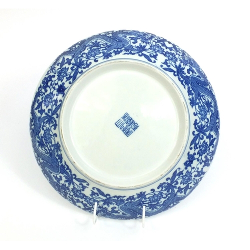 2203 - Chinese blue and white porcelain shallow dish, decorated with dragons amongst flowers and foliage, c... 