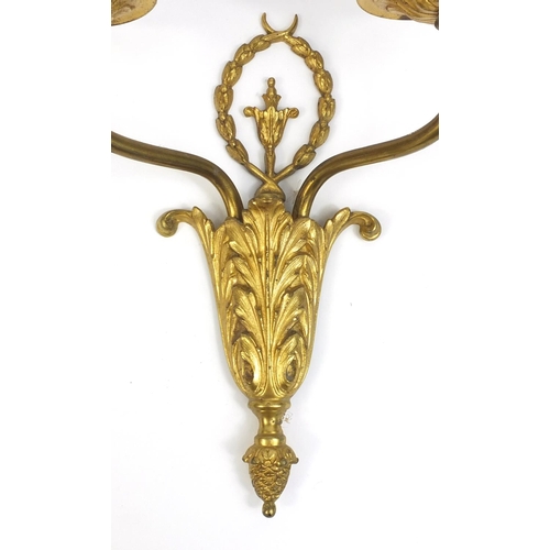 2067 - Two pairs of French empire style gilt brass wall sconces, each 43cm high