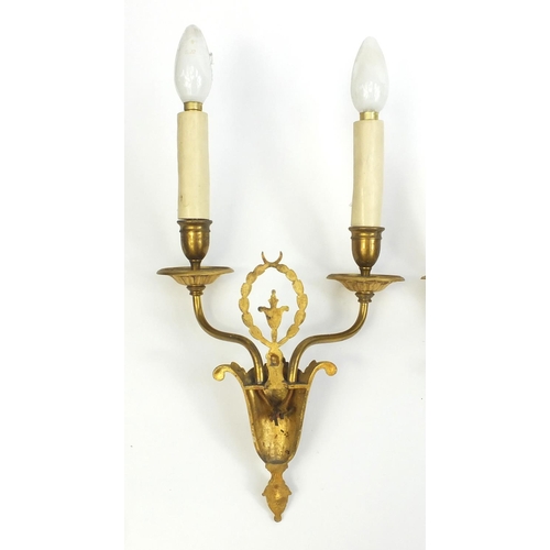 2067 - Two pairs of French empire style gilt brass wall sconces, each 43cm high