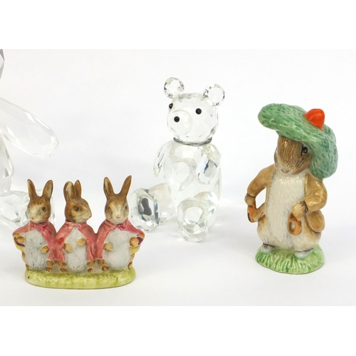 2141 - Two Royal Albert Beatrix Potter figures together with a Beswick example and two Swarovski crystal st... 