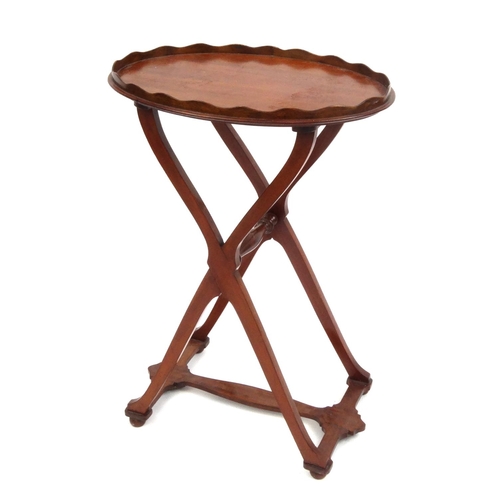 2041 - Oval mahogany X-framed occasional table with gallery top, 66cm high