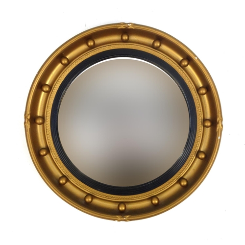 2068 - Circular gilt framed convex mirror, 42cm in diameter