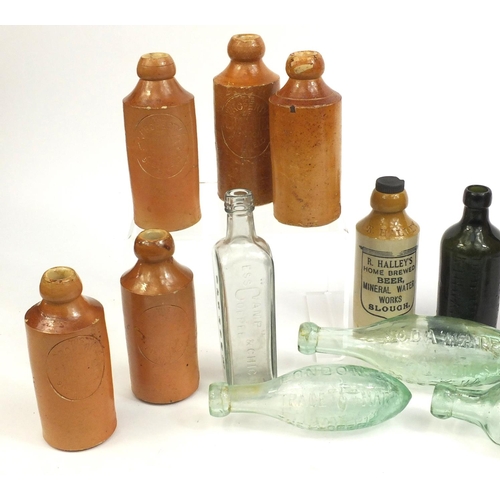 2241 - Collection of stoneware advertising bottles together with four glass examples including some Doulton... 