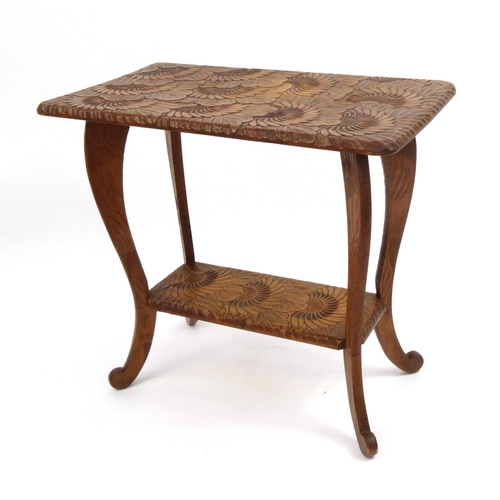 2043 - Fruitwood occasional table with under tier carved with sunflowers, 71cm high x 75cm wide x 43cm deep