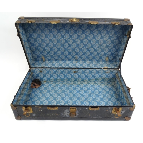 21 - Large metal bound travelling trunk, 32cm high x 100cm wide x 53cm deep