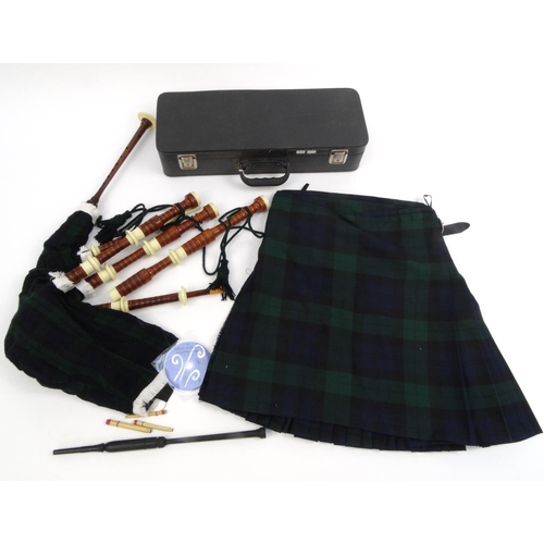 2078 - Cased set of bagpipes together with a kilt and tutor DVD, the kilt size 8