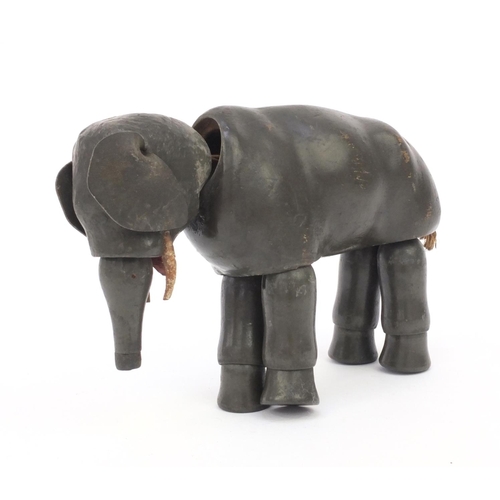 2291 - Antique articulate wooden elephant child's toy, 19cm high