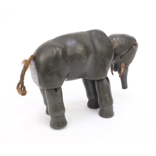 2291 - Antique articulate wooden elephant child's toy, 19cm high